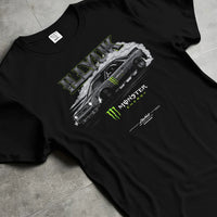 Black T-shirt laid flat with natural fabric folds, featuring rs turbo racing drift motorsport tuner street monster graphic.