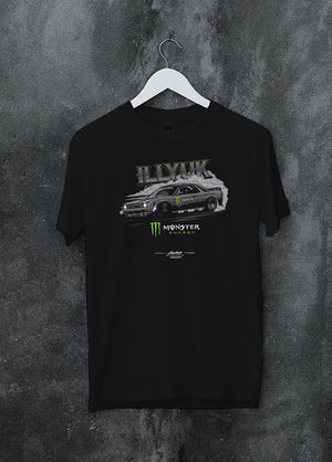 Black crewneck T-shirt on a hanger against a grey wall, featuring rs turbo racing drift motorsport tuner street monster graphic.