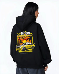 Black hoodie worn by a female model, back view, featuring jdm japanese retro vintage racing street performance motorsport graphic.