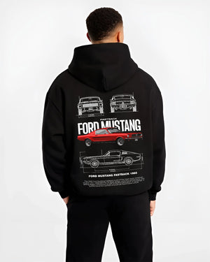 Black hoodie worn by a male model, back view, featuring Ford Mustang american muscle retro classic enthusiast racing graphic.