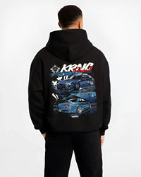 Black hoodie worn by a male model, back view, featuring Nissan Skyline R34 r34 skyline drift jdm legend racing graphic.
