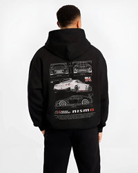 Black hoodie worn by a male model, back view, featuring Nissan GT-R gt r gran turismo legend racing street performance graphic.