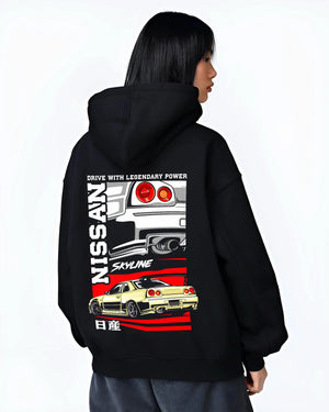 Black hoodie worn by a female model, back view, featuring Nissan Skyline R34 r34 skyline turbo drift jdm racing graphic.
