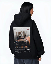 Black hoodie worn by a female model, back view, featuring Nissan GT-R R35 gt r r35 turbo racing street legend graphic.