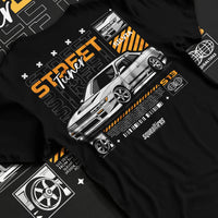 Black T-shirt laid flat with natural fabric folds, featuring Nissan Silvia S15 silvia turbo turbocharged racing drift jdm graphic.