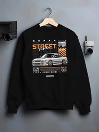 Black crewneck sweatshirt on a hanger against a grey wall, featuring Nissan Silvia S15 silvia turbo turbocharged racing graphic.