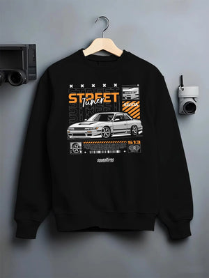 Black crewneck sweatshirt on a hanger against a grey wall, featuring Nissan Silvia S15 silvia turbo turbocharged racing graphic.