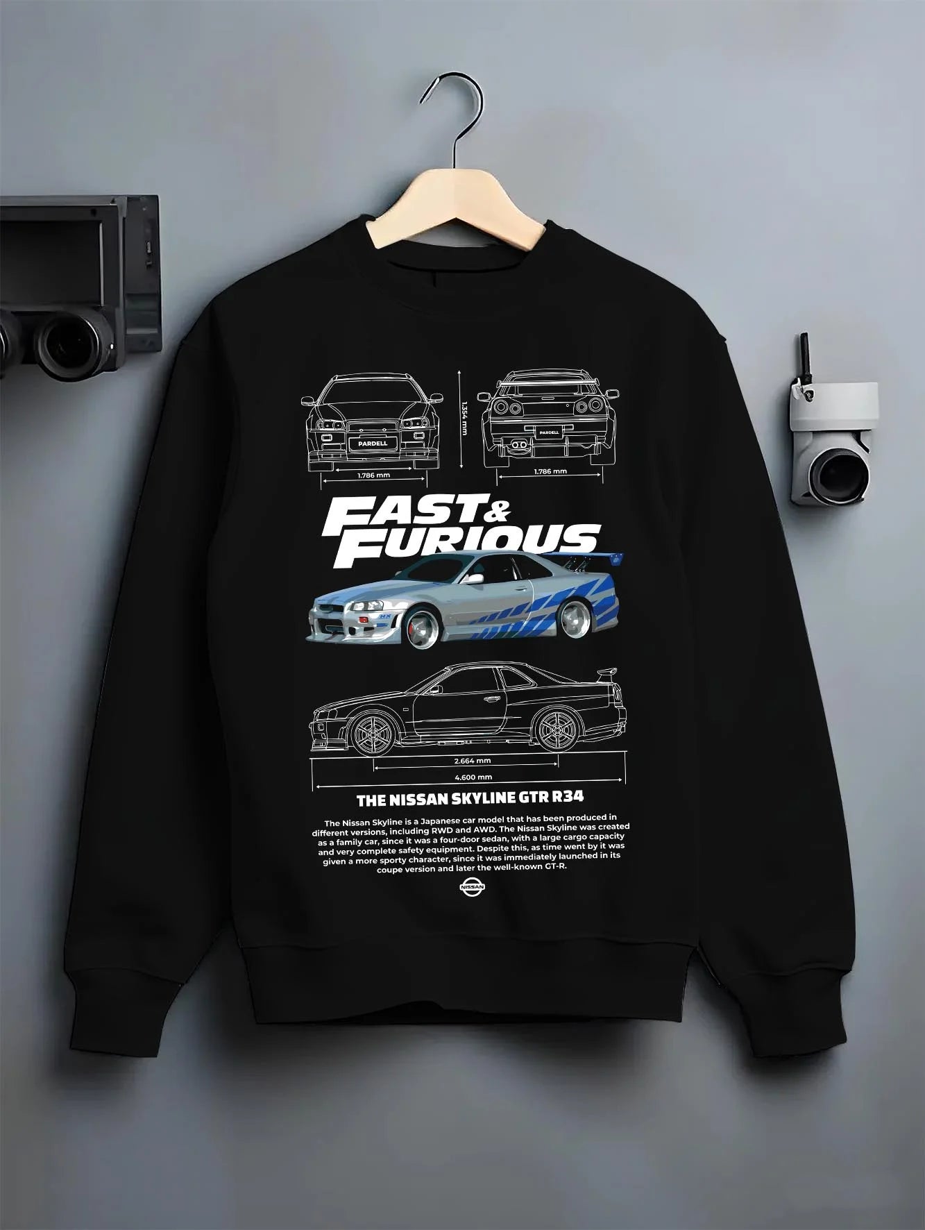 Black crewneck sweatshirt on a hanger against a grey wall, featuring Nissan Skyline R32 r32 skyline turbo racing drift jdm graphic.