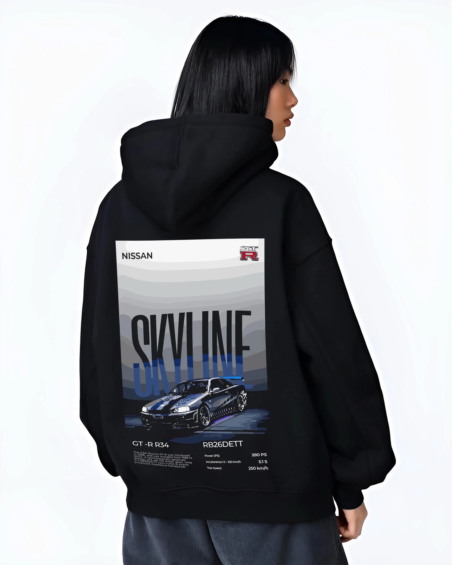 Black hoodie worn by a female model, back view, featuring Nissan Skyline R34 gt r r34 skyline rb26 jdm legend graphic.