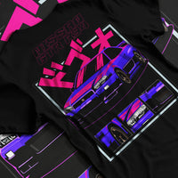Black T-shirt laid flat with natural fabric folds, featuring Nissan Skyline turbo racing drift jdm japanese tuner stance graphic.