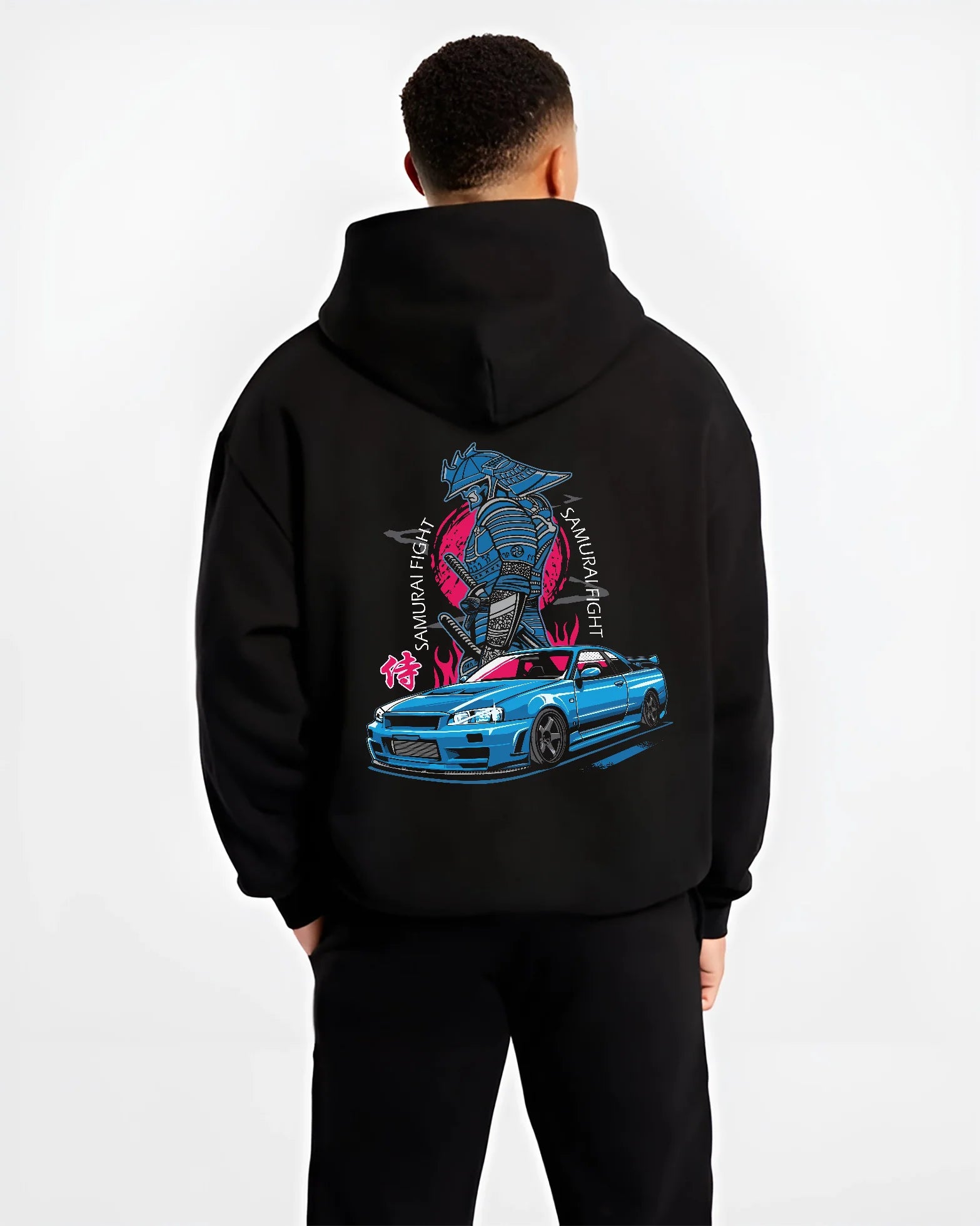 Black hoodie worn by a male model, back view, featuring Nissan Skyline R34 gt r r34 skyline drift jdm japanese street graphic.