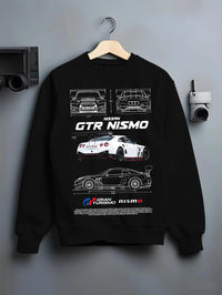 Black crewneck sweatshirt on a hanger against a grey wall, featuring Nissan Skyline R34 gtr r34 skyline turbo turbocharged nis7.