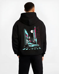 Black hoodie worn by a male model, back view, featuring Nissan GT-R gtr skyline racing drift jdm japanese street graphic.