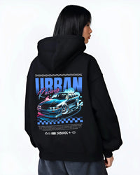 Black hoodie worn by a female model, back view, featuring Nissan Skyline racing drift jdm japanese street retro graphic.