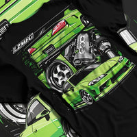 Black T-shirt laid flat with natural fabric folds, featuring Nissan rs turbo racing drift motorsport jdm japanese street graphic.