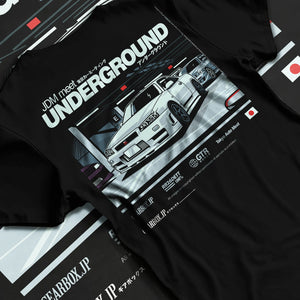 Black T-shirt laid flat with natural fabric folds, featuring Nissan 240SX rs turbo racing drift jdm japanese street classic graphic.