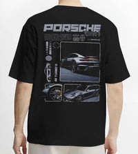 Black T-shirt worn by a male model, back view, featuring Porsche 911 Turbo S rs 911 turbo racing motorsport street graphic.