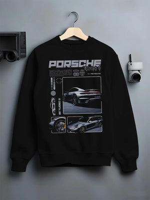 Black crewneck sweatshirt on a hanger against a grey wall, featuring Porsche 911 Turbo S rs 911 turbo racing motorsport graphic.