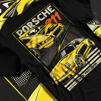 Black T-shirt laid flat with natural fabric folds, featuring Porsche 911 rs racing motorsport street retro vintage classic graphic.