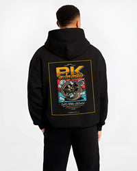 Black hoodie worn by a male model, back view, featuring street racing performance motorsport automotive enthusiast power pkauto.