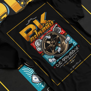 Black T-shirt laid flat with natural fabric folds, featuring street racing performance motorsport automotive enthusiast pkauto.