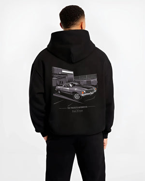 Black hoodie worn by a male model, back view, featuring CHEVROLET muscle retro classic enthusiast racing street performance graphic.