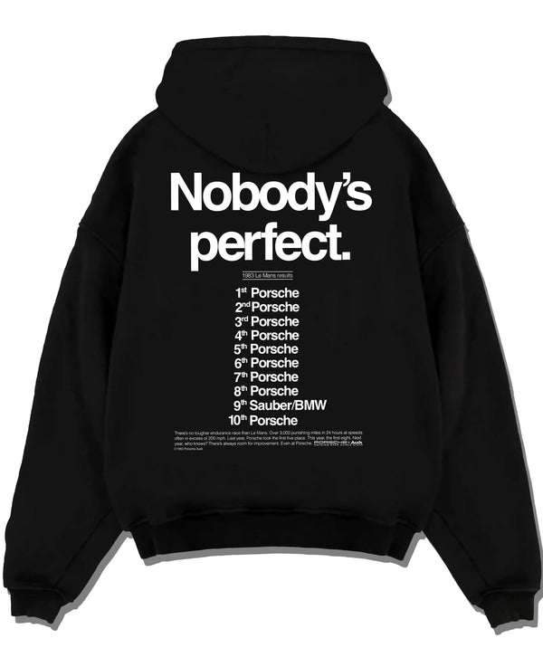 Black pullover hoodie laid flat on a white background, featuring Porsche rs racing le mans motorsport street performance graphic.