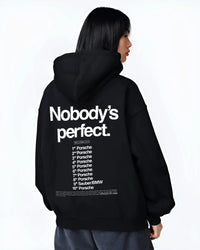 Black hoodie worn by a female model, back view, featuring Porsche rs racing le mans motorsport street performance graphic.
