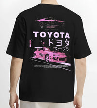 Black T-shirt worn by a male model, back view, featuring Toyota Supra racing drift jdm japanese tuner street retro graphic.