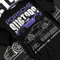 Black T-shirt laid flat with natural fabric folds, featuring Porsche Taycan rs turbo turbocharged racing german tuner graphic.