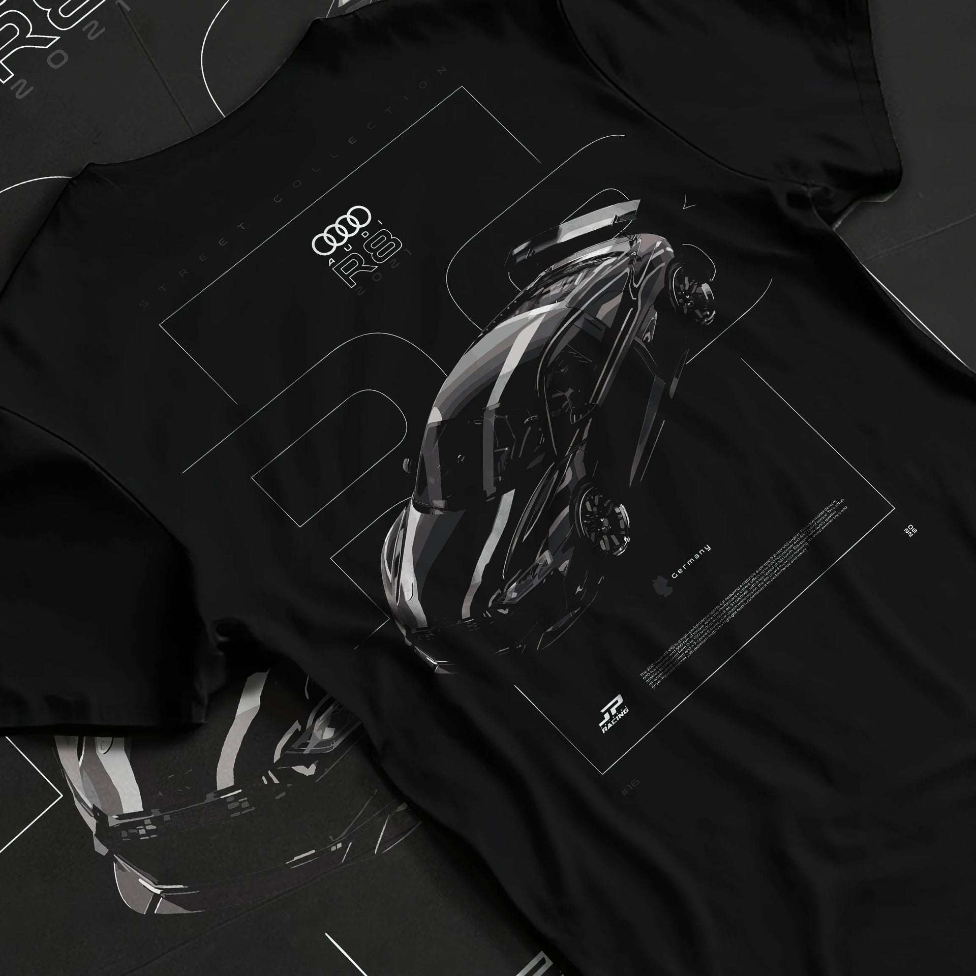 Black T-shirt laid flat with natural fabric folds, featuring Audi R8 turbo racing german street performance motorsport graphic.