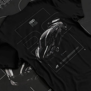 Black T-shirt laid flat with natural fabric folds, featuring Audi R8 turbo racing german street performance motorsport graphic.