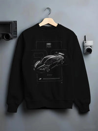 Black crewneck sweatshirt on a hanger against a grey wall, featuring Audi R8 turbo racing german street performance graphic.