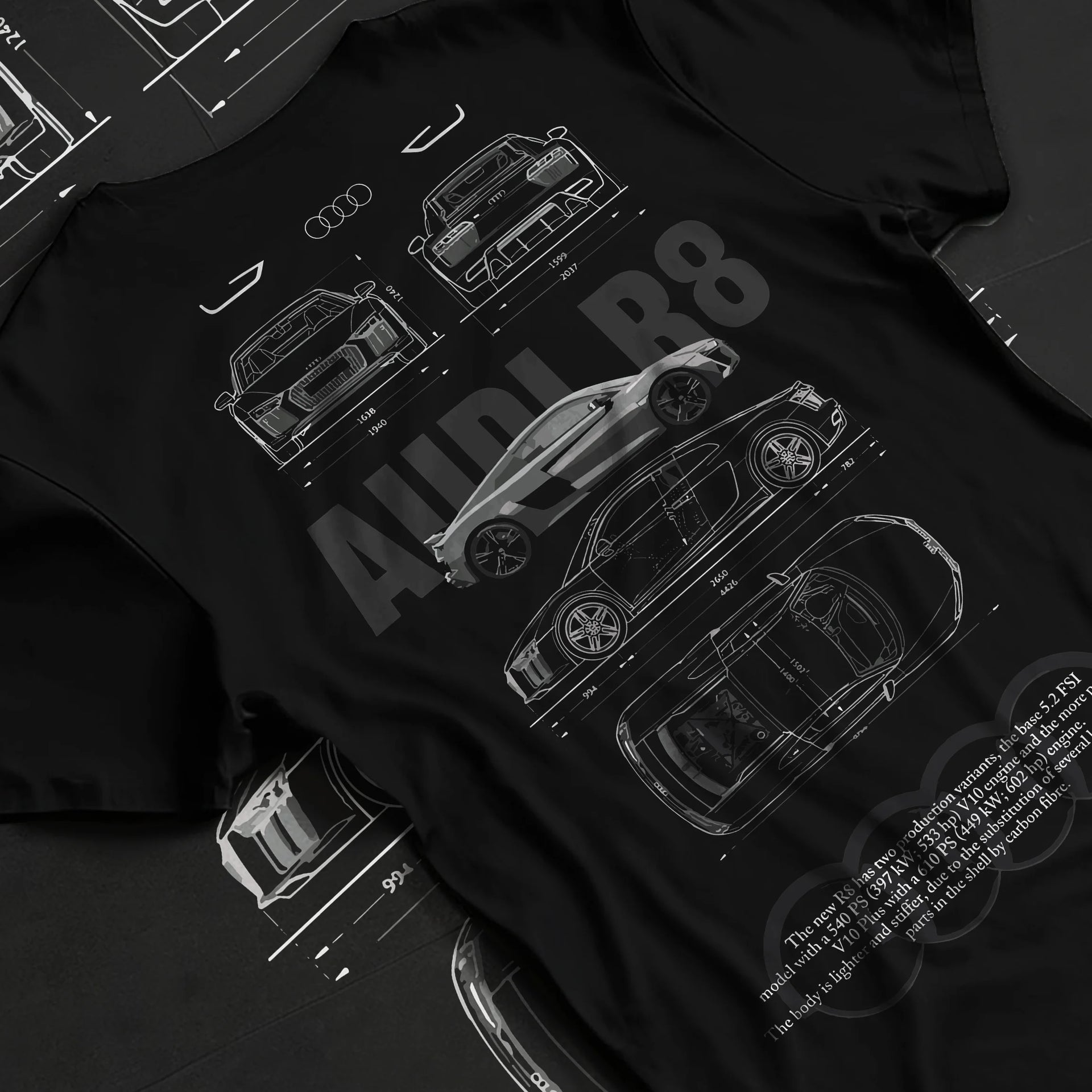 Black T-shirt laid flat with natural fabric folds, featuring Audi R8 v10 racing german street performance motorsport graphic.