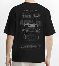Black T-shirt worn by a male model, back view, featuring Audi R8 v10 euro enthusiast racing street performance graphic.