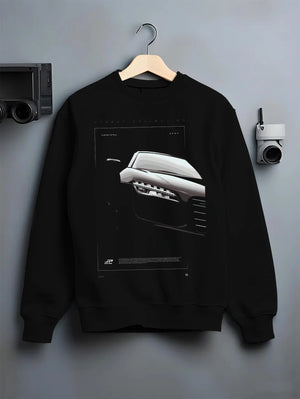 Black crewneck sweatshirt on a hanger against a grey wall, featuring Audi R8 turbo v10 racing german street performance graphic.