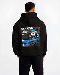 Black hoodie worn by a male model, back view, featuring Mazda RX-7 rx7 drift japanese street racing performance graphic.