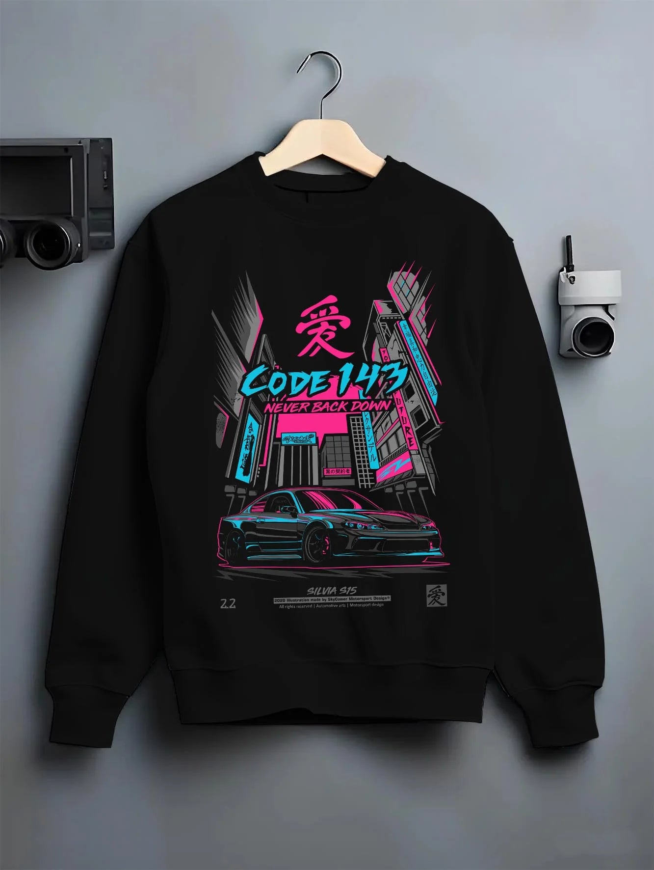Black crewneck sweatshirt on a hanger against a grey wall, featuring SILVIA racing drift jdm japanese street performance graphic.