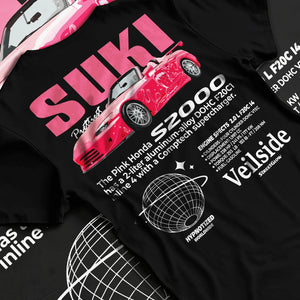 Black T-shirt laid flat with natural fabric folds, featuring Honda S2000 drift jdm japanese tuner street racing graphic.