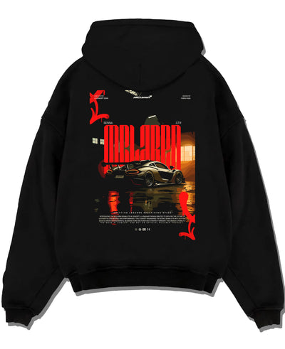 Black pullover hoodie laid flat on a white background, featuring McLaren SENNA track street racing performance motorsport graphic.
