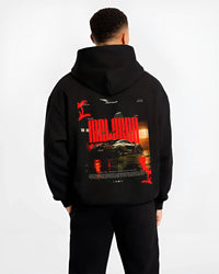 Black hoodie worn by a male model, back view, featuring McLaren SENNA track street racing performance motorsport automotive graphic.
