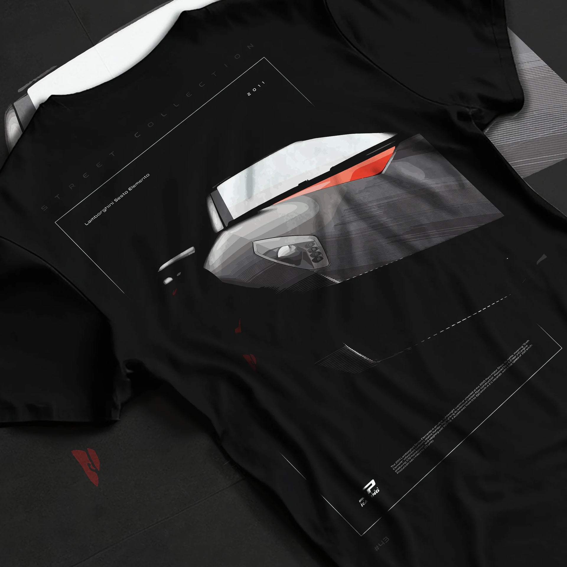 Black T-shirt laid flat with natural fabric folds, featuring Lamborghini racing street enthusiast performance motorsport graphic.