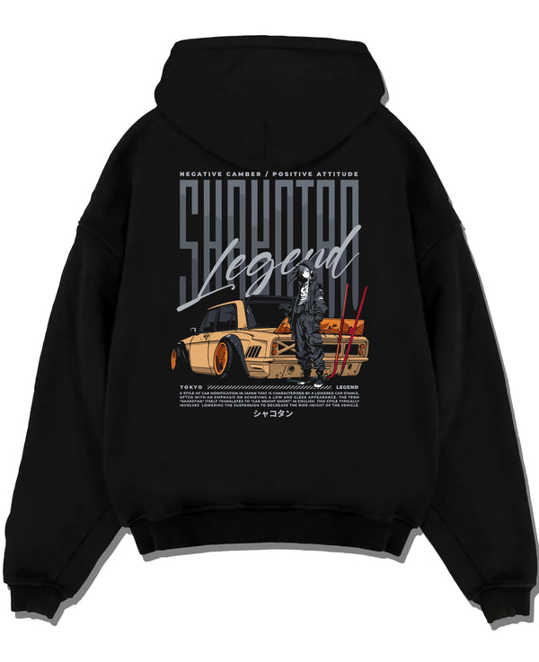 Black pullover hoodie laid flat on a white background, featuring Toyota jdm stance legend racing street performance graphic.