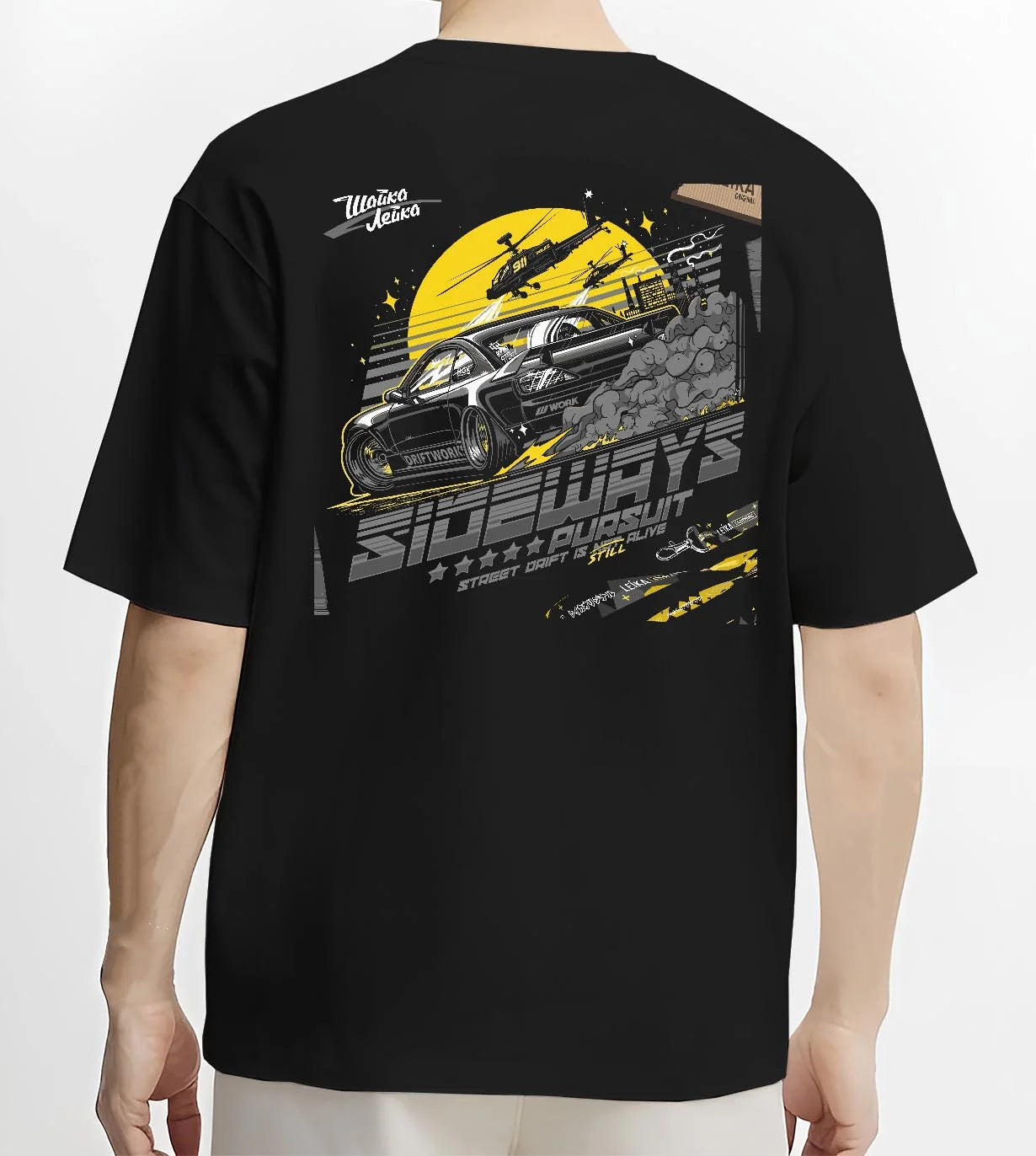 Black T-shirt worn by a male model, back view, featuring rs turbo turbocharged racing drift jdm japanese tuner tokyo street graphic.