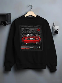Black crewneck sweatshirt on a hanger against a grey wall, featuring SKYLINE racing drift japanese tuner stance street graphic.