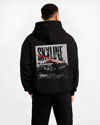 Black hoodie worn by a male model, back view, featuring Nissan Skyline R34 r34 skyline turbo turbocharged racing jdm street graphic.
