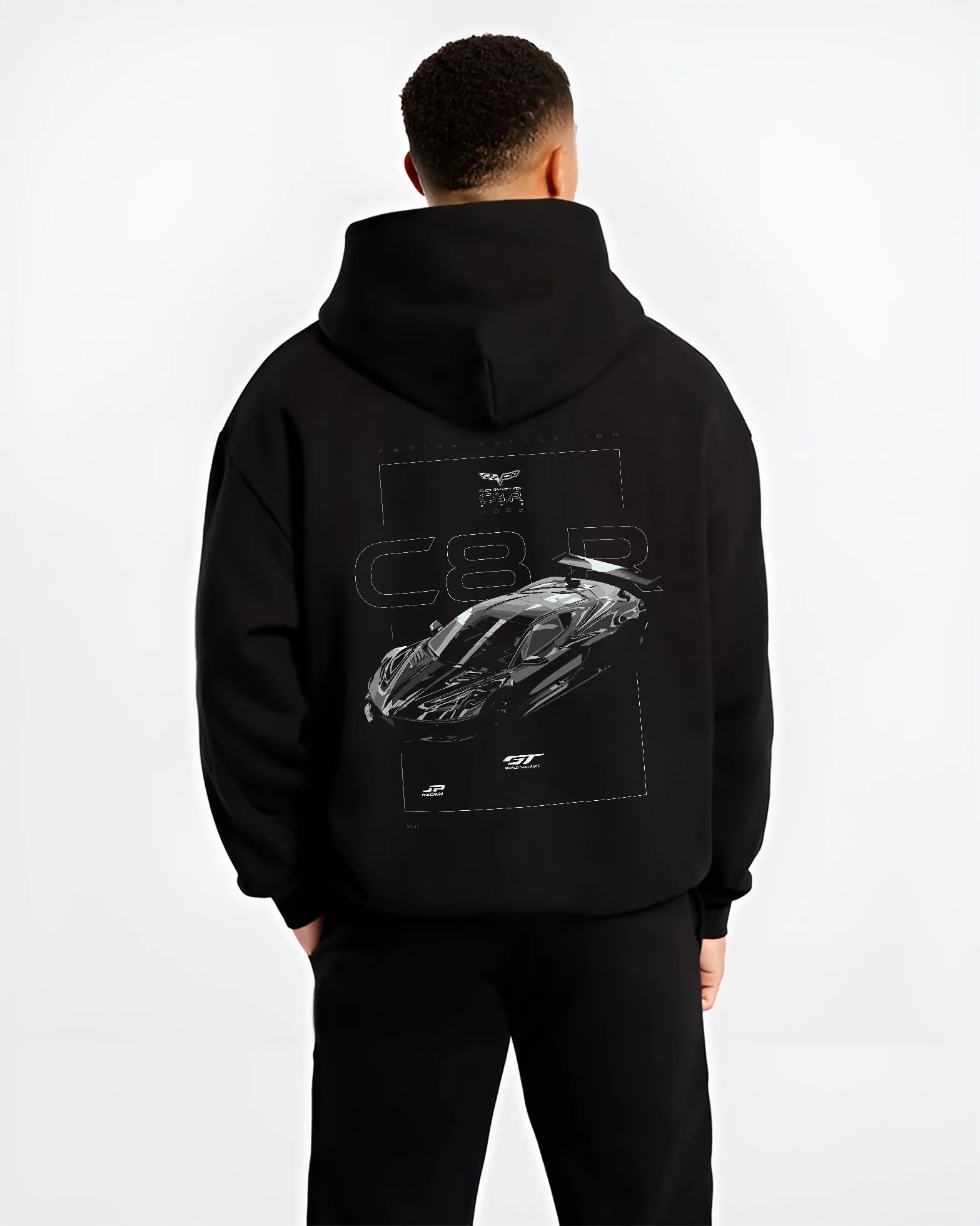 Black hoodie worn by a male model, back view, featuring Chevrolet Corvette C6 corvette racing muscle street enthusiast graphic.