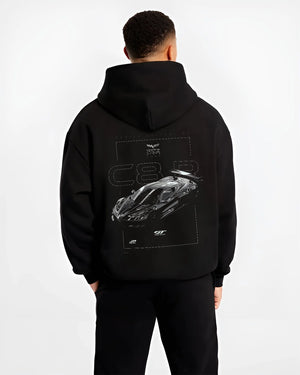 Black hoodie worn by a male model, back view, featuring Chevrolet Corvette C6 corvette racing muscle street enthusiast graphic.