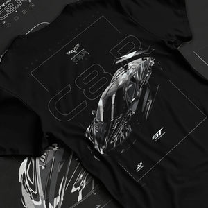 Black T-shirt laid flat with natural fabric folds, featuring Chevrolet Corvette C6 corvette racing muscle street enthusiast graphic.