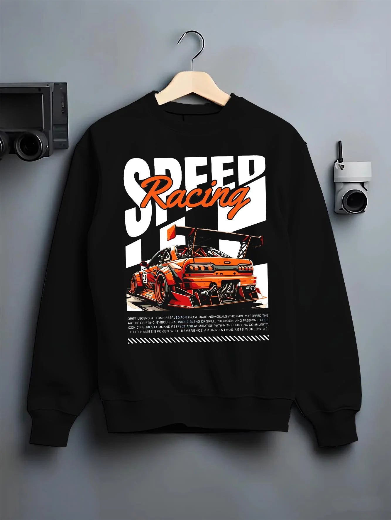 Black crewneck sweatshirt on a hanger against a grey wall, featuring rs racing drift motorsport jdm japanese street speed graphic.